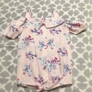 This is a light pink blouse with flowers